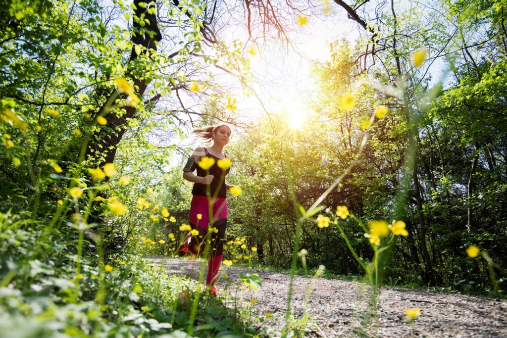 woman running on nature trail