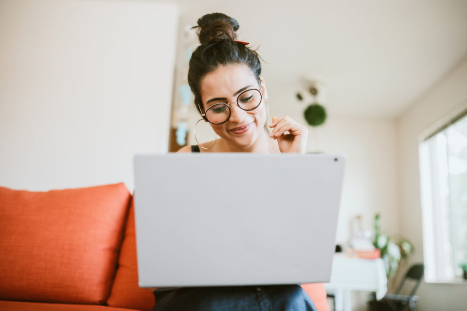 Woman Working Online On Laptop At Home