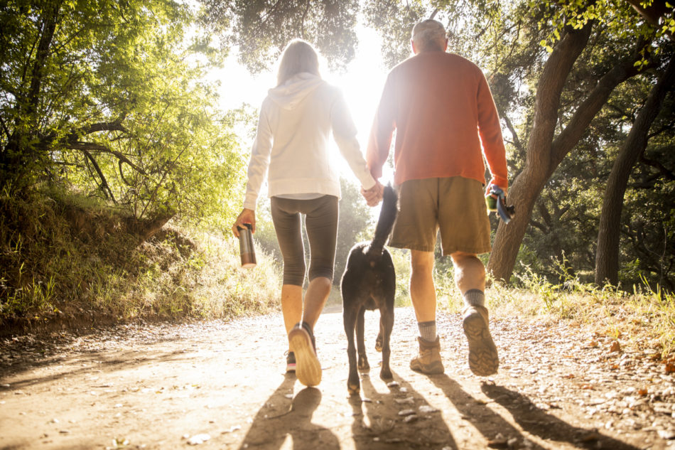 Active senior couple on a hike outdoors