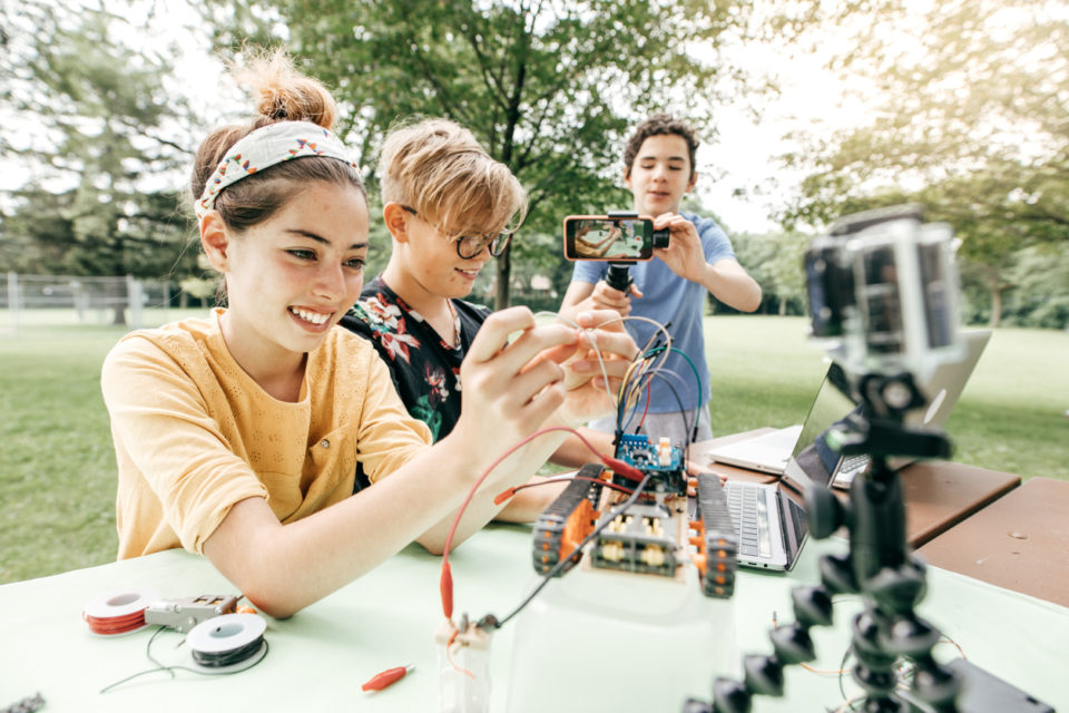 Teens work on a STEM Summer Camp project