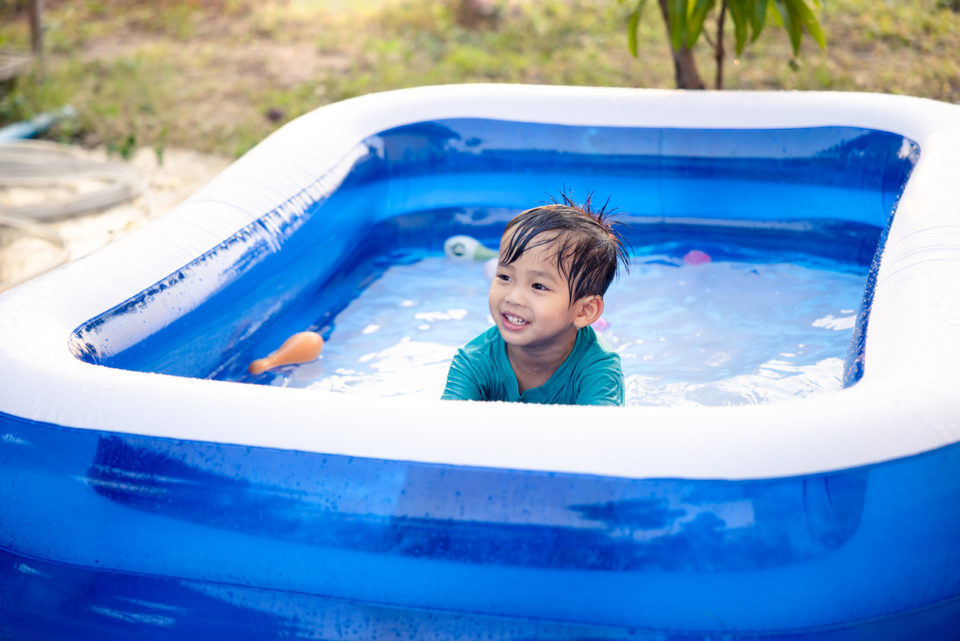 kid in blow up pool