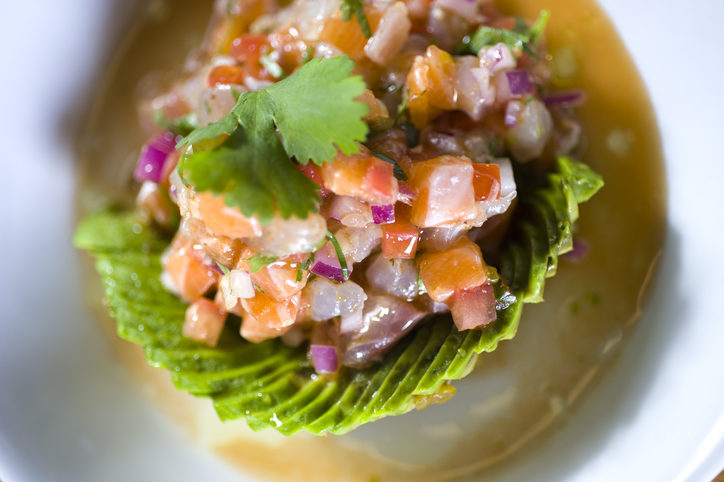 Avocado wrapped Ceviche topped with parsley. Seasoned with lime juice & spices to taste.
